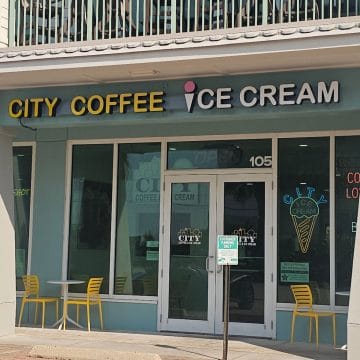 City Coffee Ice Cream sign over the glass door entrance