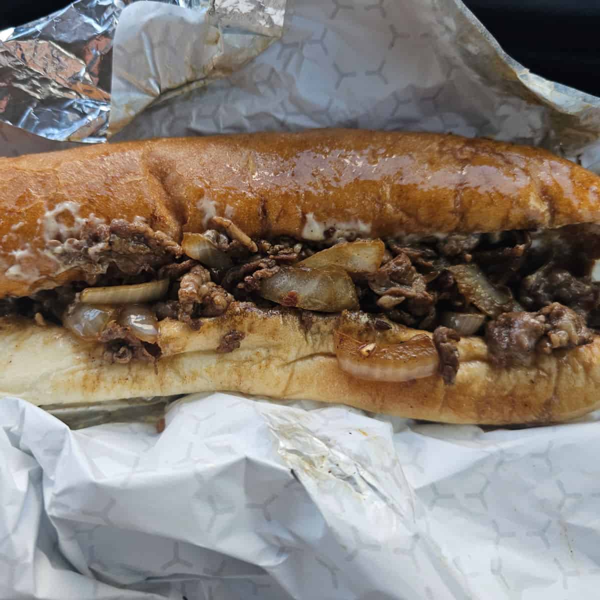 steak and onion sub wrapped in foil