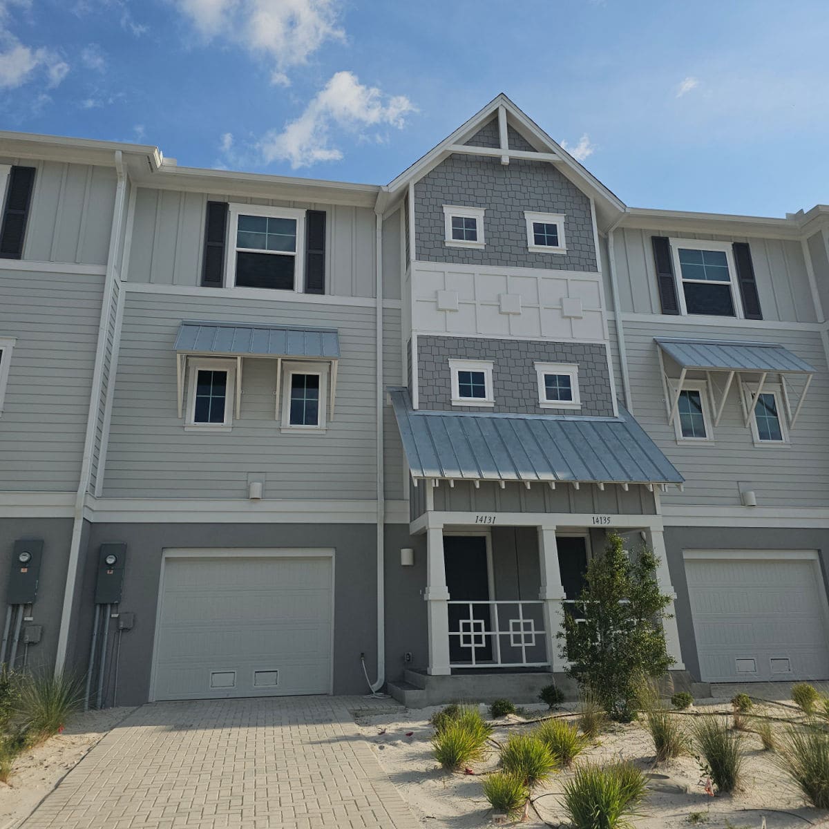 Townhome building with blue and grey paint