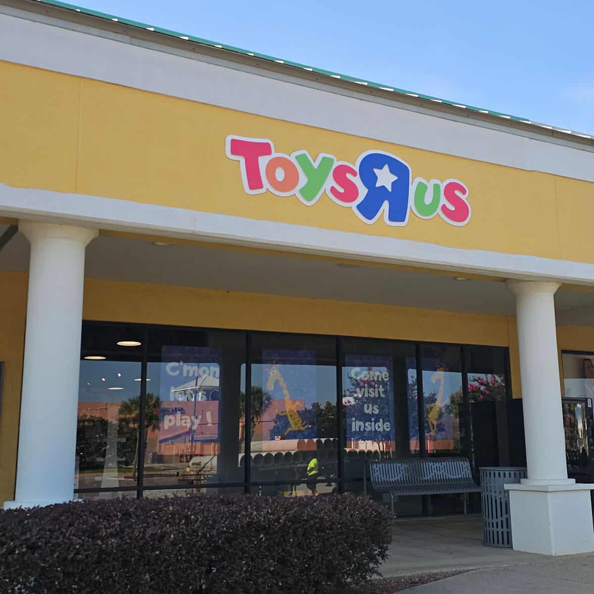ToysRus sign on a yellow background above the entrance to the store