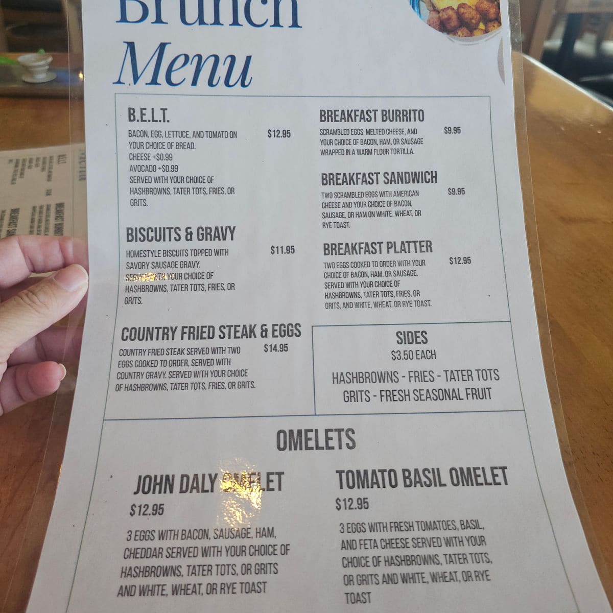 Grille 625 breakfast menu with omelets and sandwiches