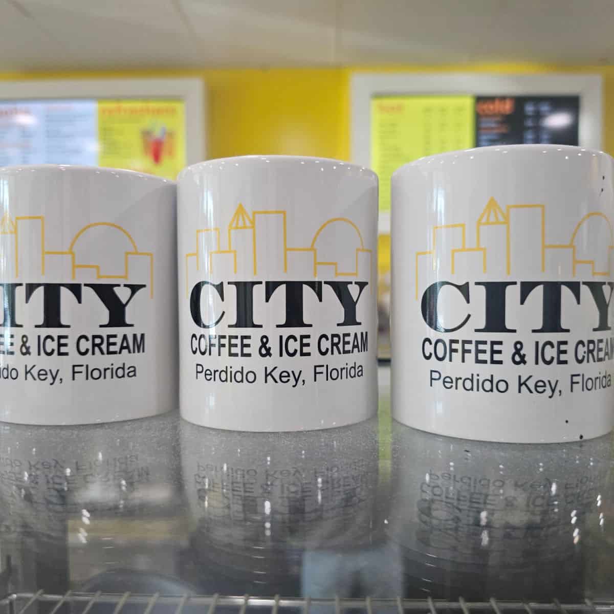 Citty Coffee & Ice Cream mugs on top of a counter