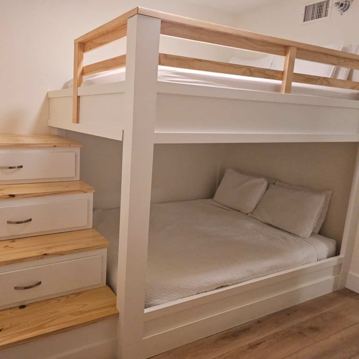 bunkbed with steps that have drawers in them