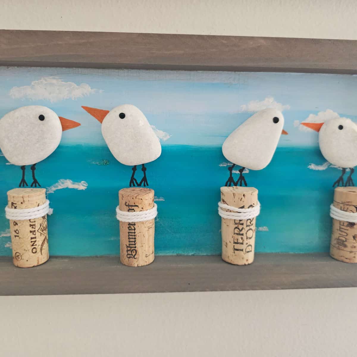coastal art made with wine corks and rock birds