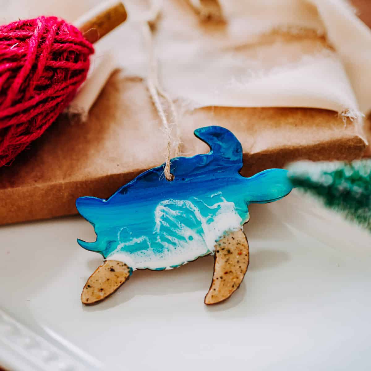 Turtle ornament with waves and blue on it