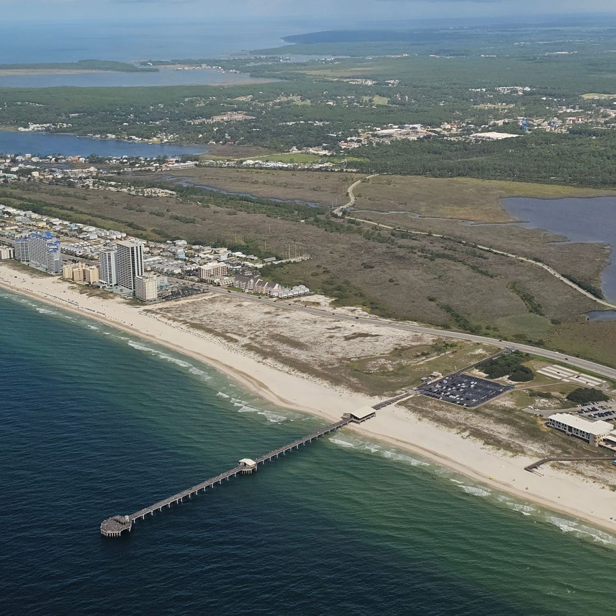 Looking over Gulf State Park pier and Gulf State Park, Gulf Shores from the air