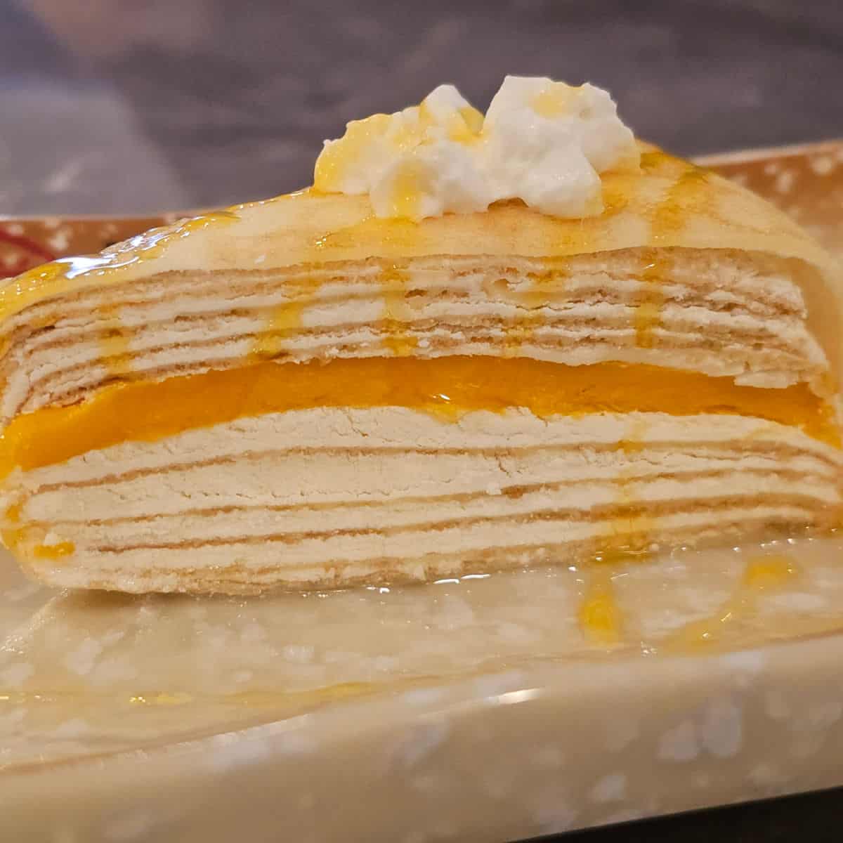 Mango crepe cake on a platter