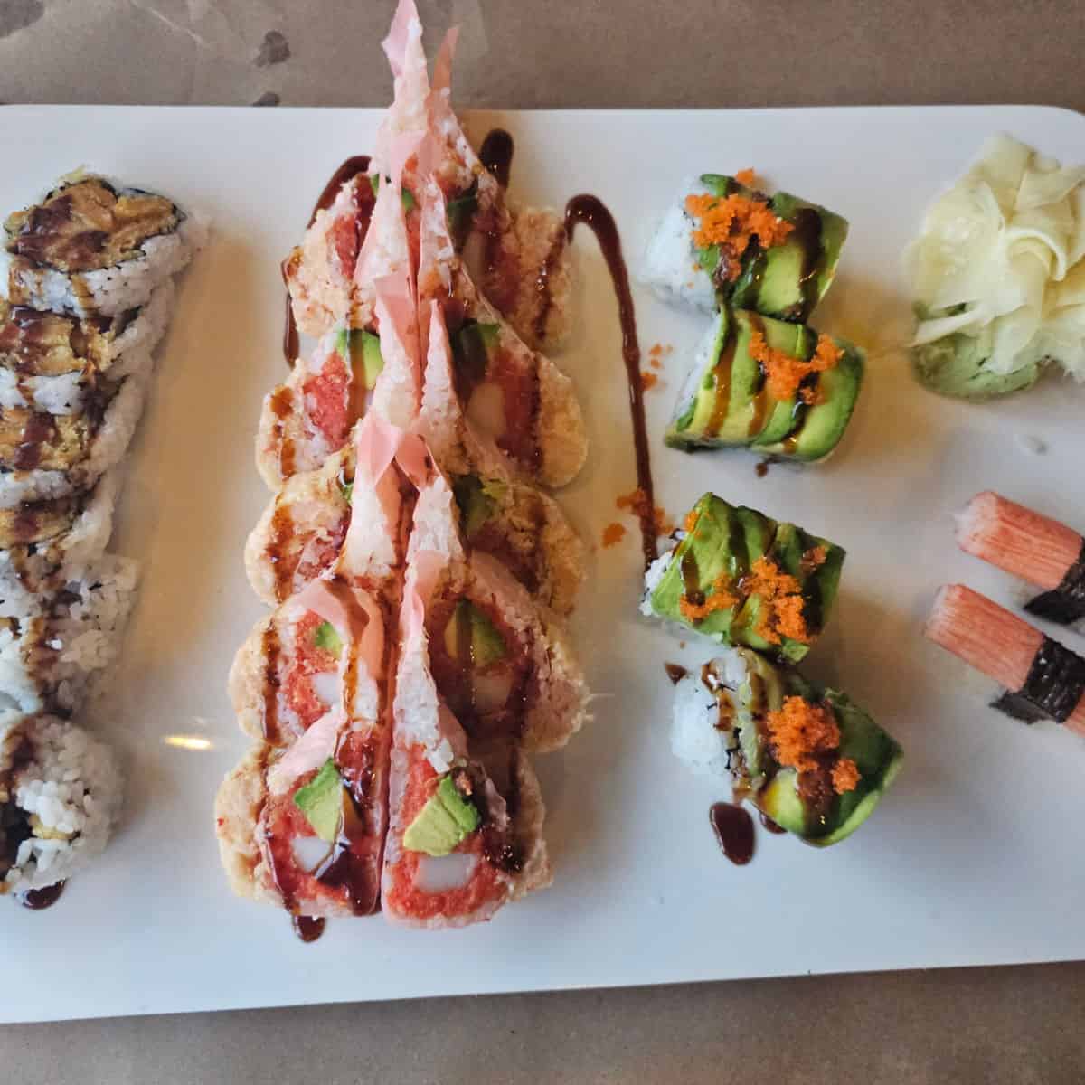 White platter with sushi rolls