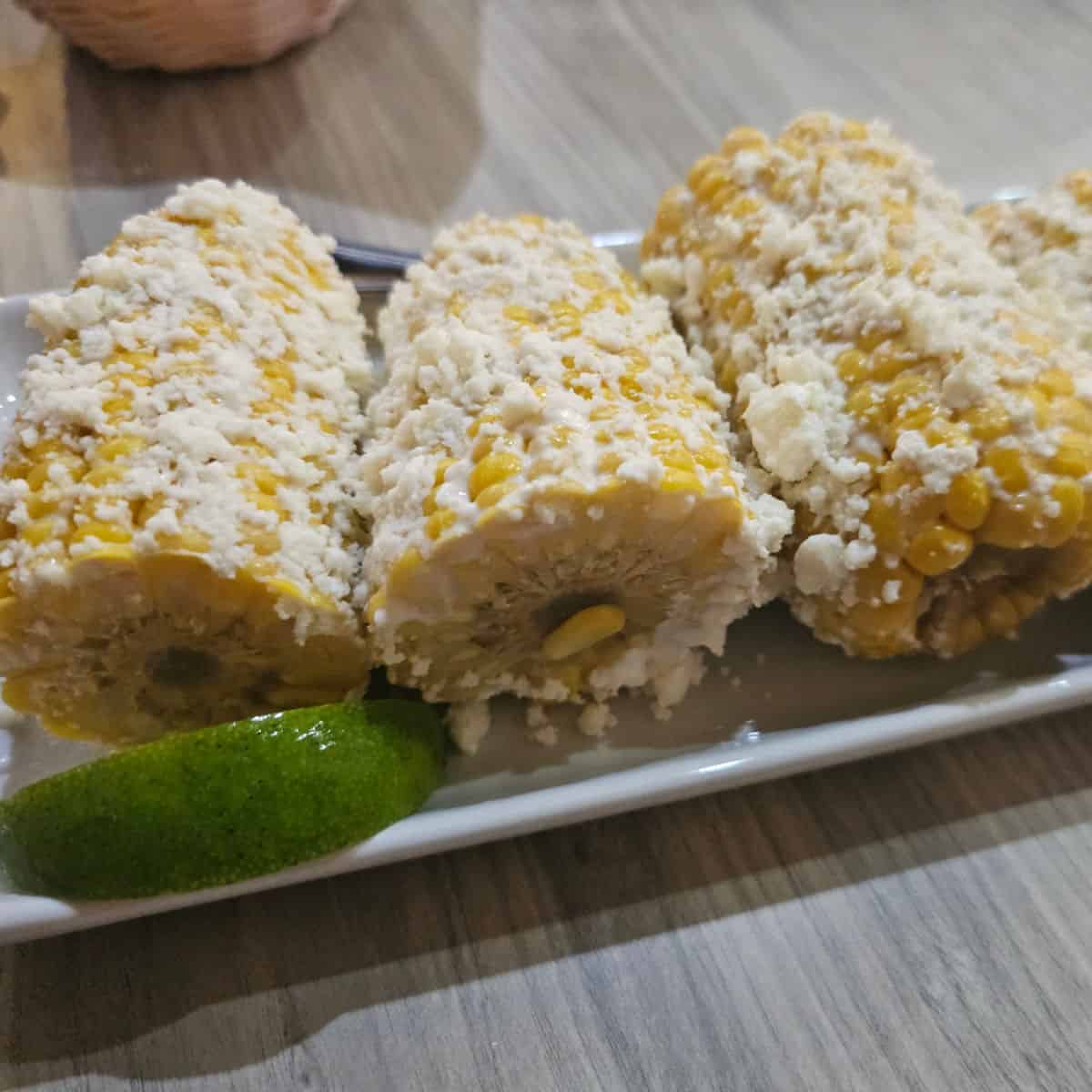 Elote Corn on a white platter