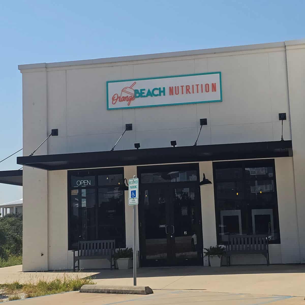 Orange Beach Nutrition sign over the front entrance to the shop