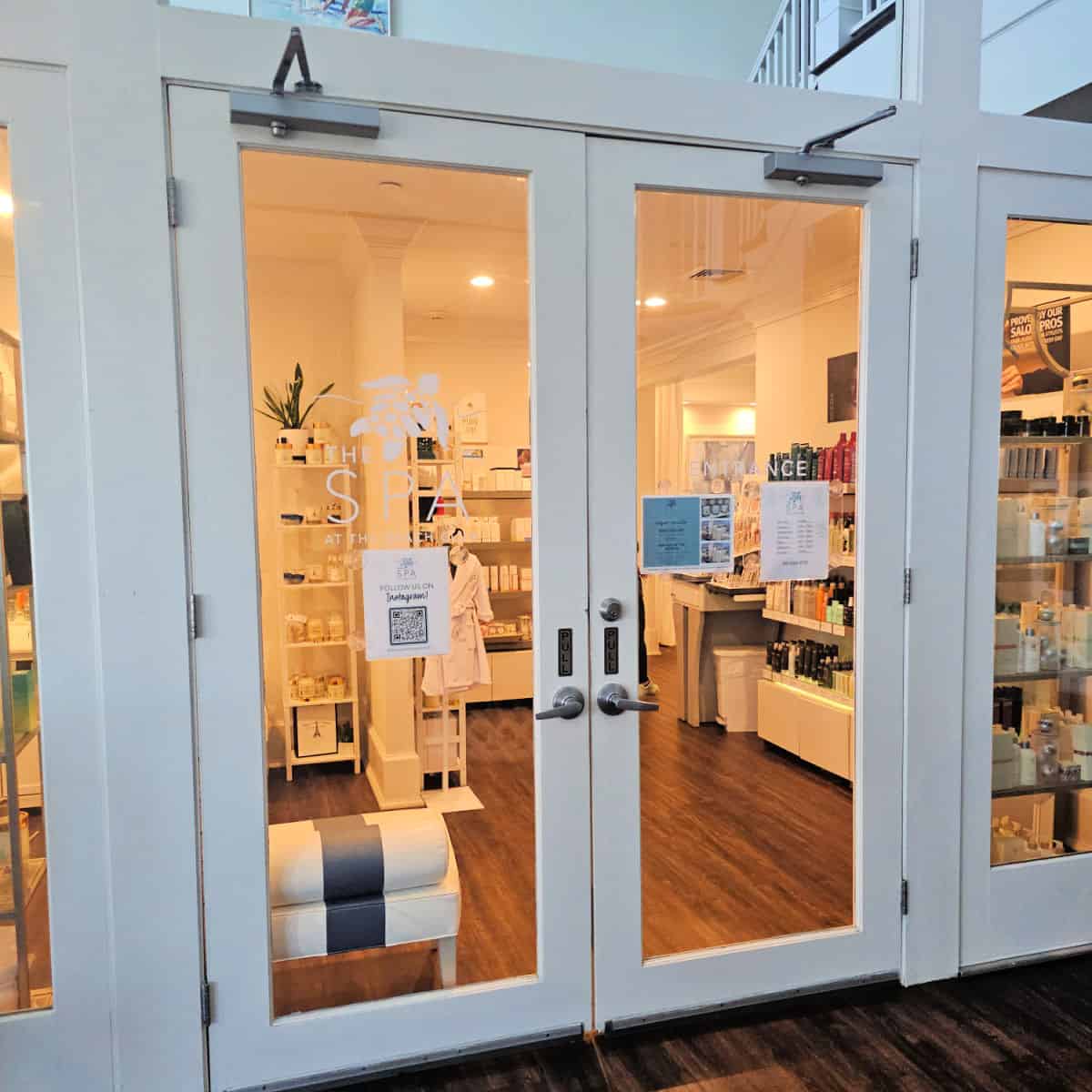 Front entrance to The Spa at the Beach Club with glass doors looking into the store area