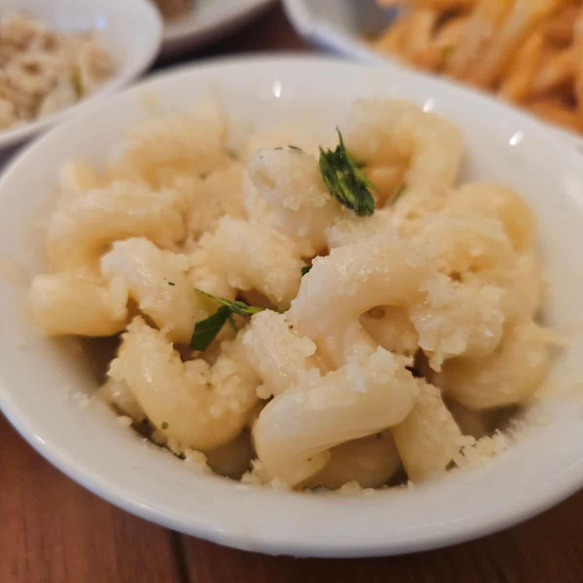 mac and cheese in a white bowl