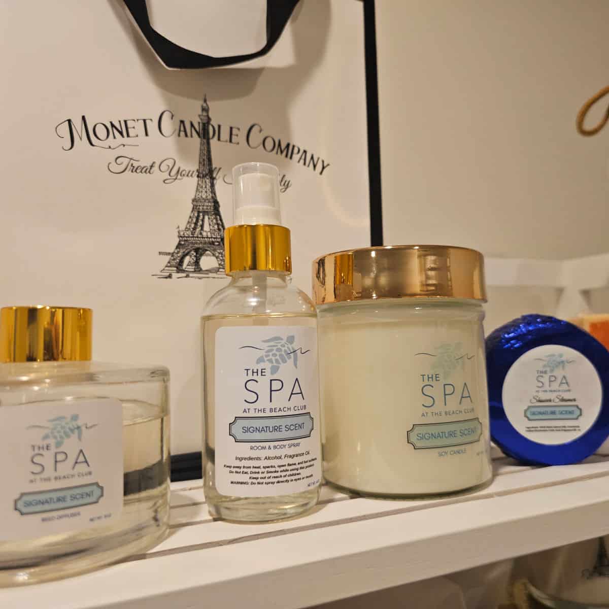 The Spa at The Beach Club products on a shelf with signature scents